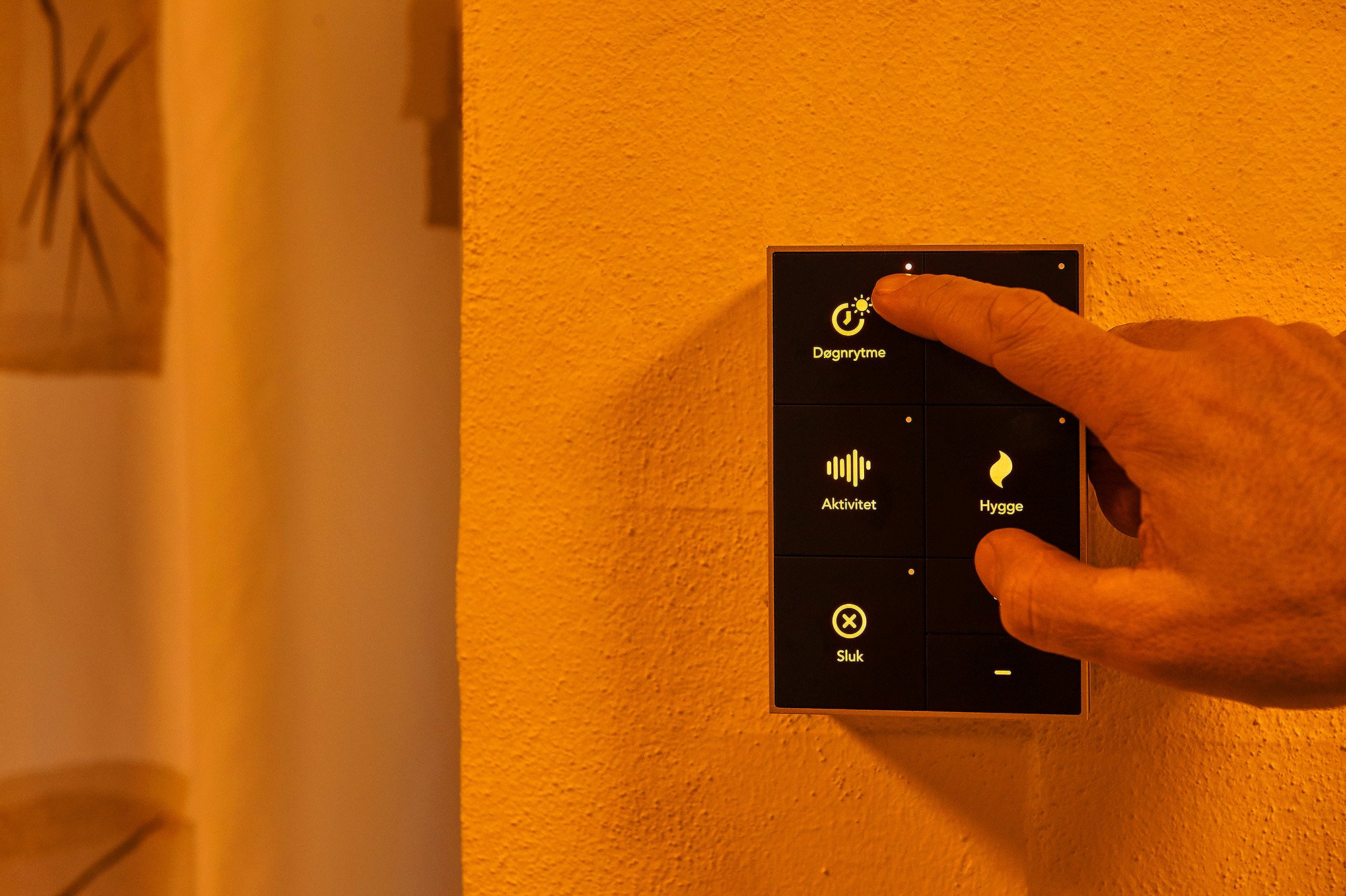 Hand presses on the circadian lighting button on the wall panel