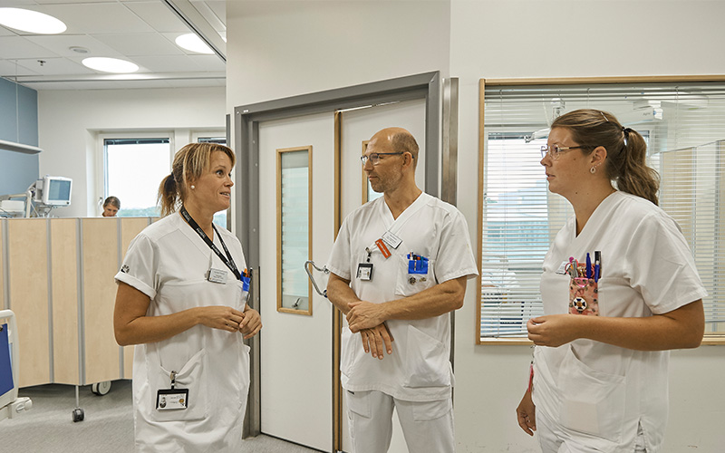 Healthcare Personnel Talkingin a hospital hallway
