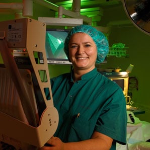 Operating room nurse Yvonne Hansen in the operating theater with ergonomic lighting from Chromaviso