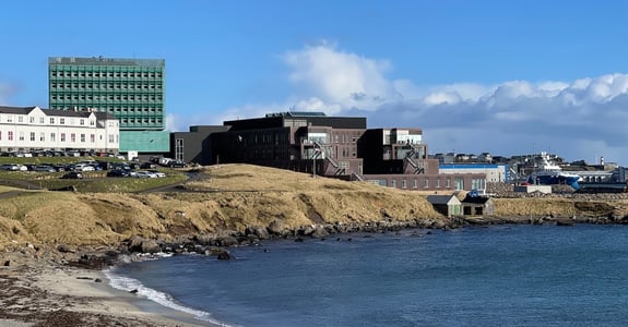The new hospital expansion on the Faroe Islands in sunny weather seen from the beach