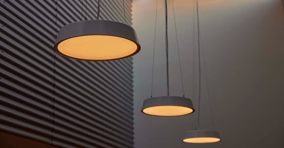 Chromaviso's circadian lights hanging in a long row from the ceiling of a nursing home