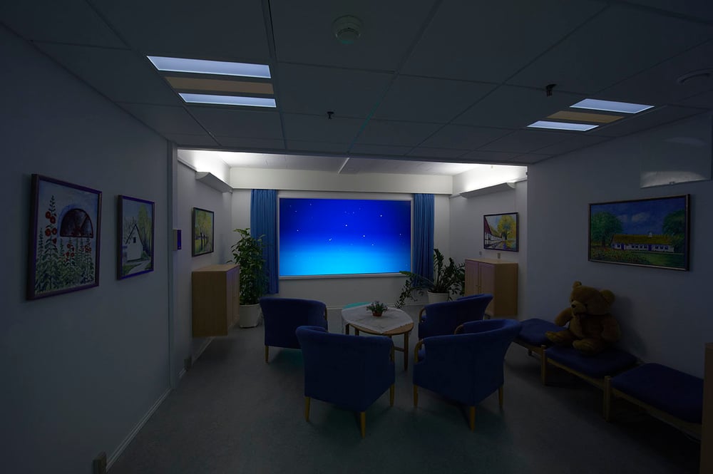 Sensory room with the night sky on the screen and Chromaviso's circadian lighting in the ceiling